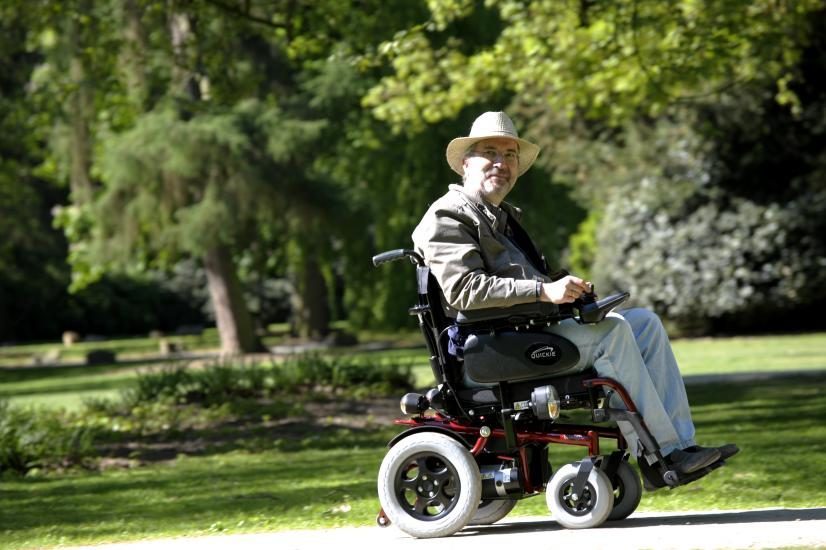 Elderly Man in Electric Wheelchair